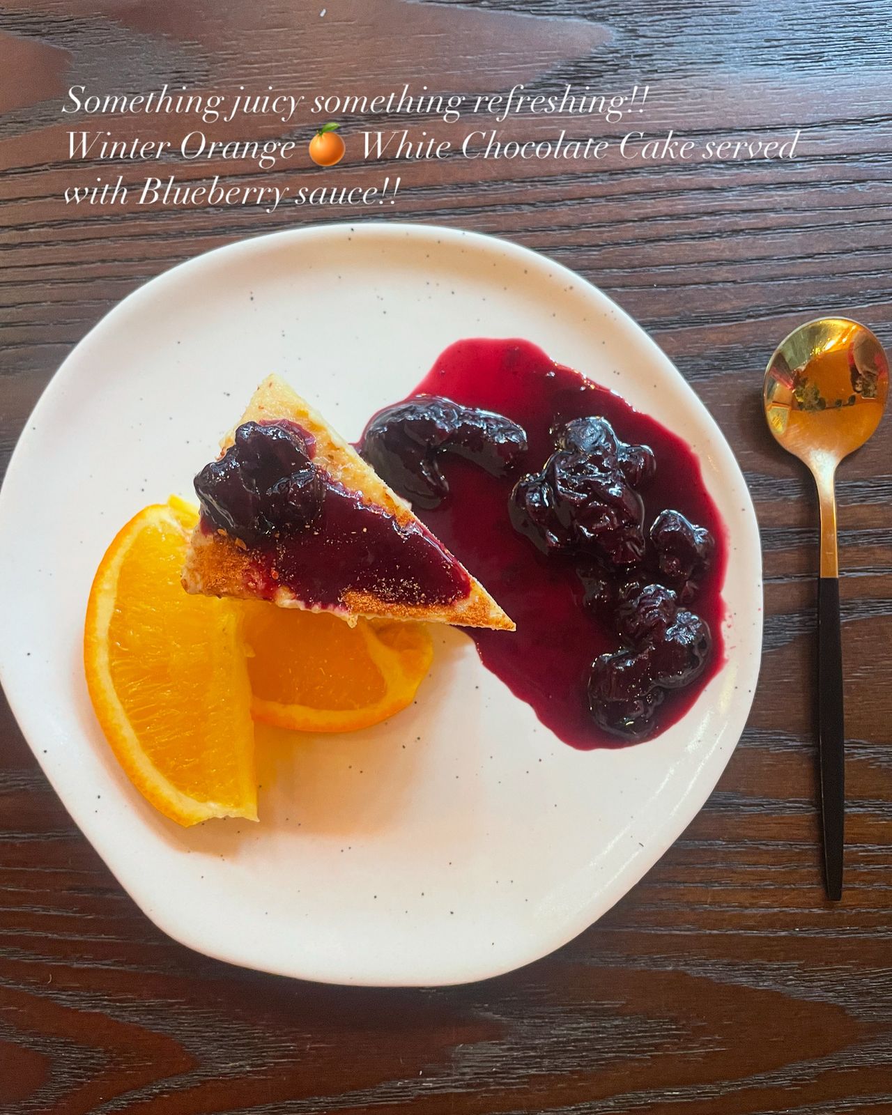 Winter Orange White Chocolate Cake Served with Blueberry Souce